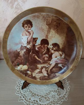 Vecchio piatto decorativo in porcellana Murillo.
