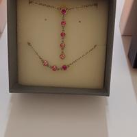 Collana e bracciale con punti luce rosa