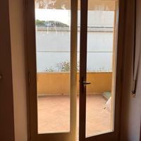 Due porta finestra un finestra in legno