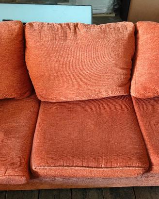 Divano angolare in tessuto rosso mattone/terracott