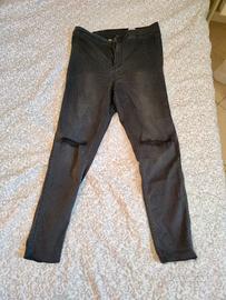 Jeans skinny con strappi a vita alta