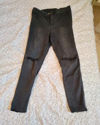 Jeans skinny con strappi a vita alta