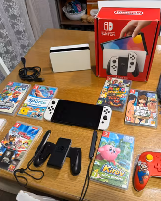Nintendo Switch OLED bianca + 7 giochi e accessori