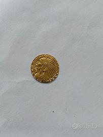 Moneta d'oro più piccola al mondo