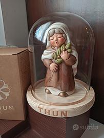 donna con ulivo con campana Thun