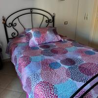 Letto in ferro battuto + rete a doghe in legno