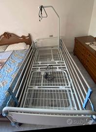 Letto rete elettrico con sponde e alzamalato