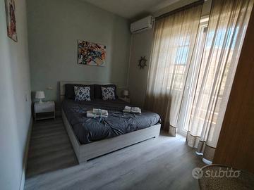 Stanza in casa con 4 stanze via america