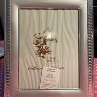 Cornice in argento