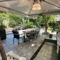 Elegante Residenza con Giardino Privato