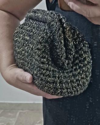 clouch bag in lurex nero e dorato.