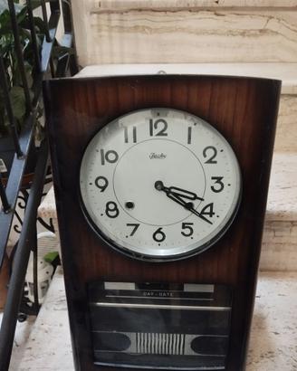 orologio a pendolo con data