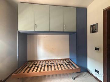Armadio ponte con letto