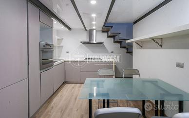 Bilocale moderno con loft e cortile privato