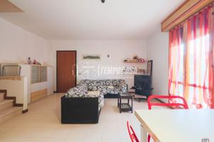 AMPIO TRILOCALE CON GIARDINO E POSTO AUTO