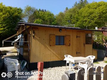Roulotte stanziale con casetta in legno