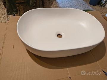 Lavabo da appoggio ovale in ceramica bianca lucida