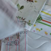 Cuscino e biancheria per lettino