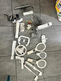 Wii + pad +caricabatterie+strumenti per giocare