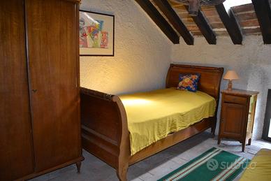 Letto antico a barca in legno massello