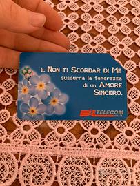 Scheda telefonica della Telecom con fiori