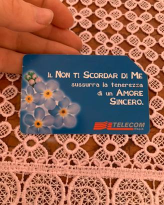 Scheda telefonica della Telecom con fiori