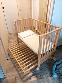 Culla con materassino e cuscino