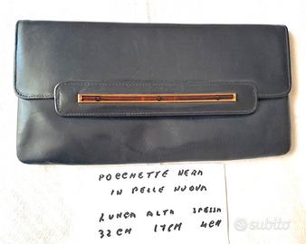 Pochette in pelle lunga 32, alta 17, spessa 4 cm.
