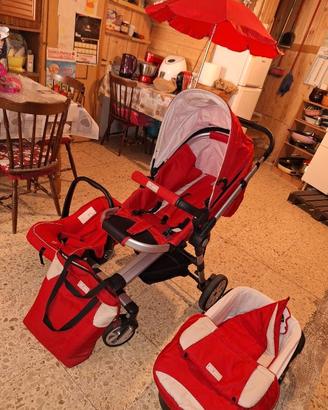 Passeggino rosso + accessori