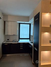 Cucina legno rovere ed elettrodomestici Smeg