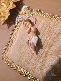 bambinelli in prezioso cuscino