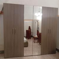 Camera da letto e parete attrezzata