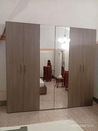 Camera da letto e parete attrezzata