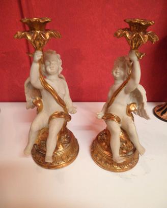 Coppia di puttini monocera in foglia oro