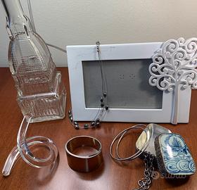 Gioielli acciaio, argento e materiale plastico