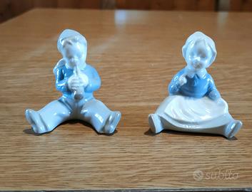 Coppia di statuine in porcellana vintage