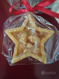 candela profumata a forma di stella con presepe 