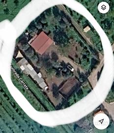 Terreno con casa