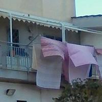 TENDA A RULLO CON BRACCI LATERALI