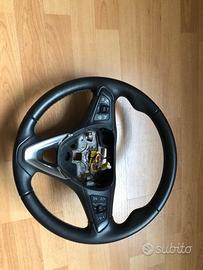 Volante Opel astra con comandi