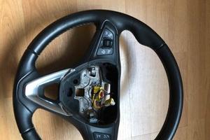 Volante Opel astra con comandi