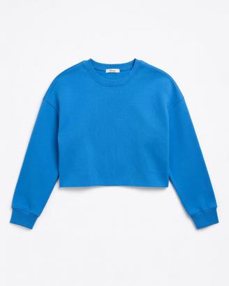 Felpa cropped blu con maniche Sinsay