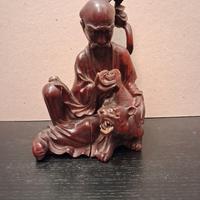 Coppia di statuine orientali in legno