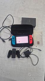 Nintendo Switch con accessori e un gioco