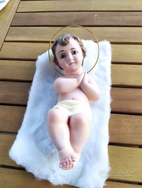 Bambinello in gesso con occhi di vetro