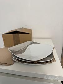 Set di tre piatti Guzzini