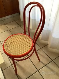 4 sedie rosse con coprisedia