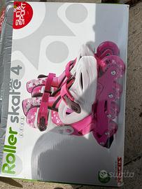 Pattini a rotelle fucsia e bianchi taglia 31-35