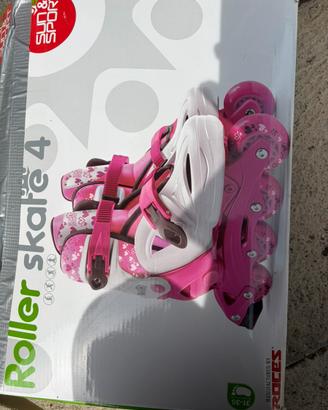 Pattini a rotelle fucsia e bianchi taglia 31-35