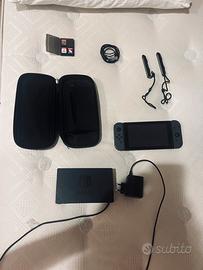 Nintendo Switch + Cover, Station, Pad e giochi.